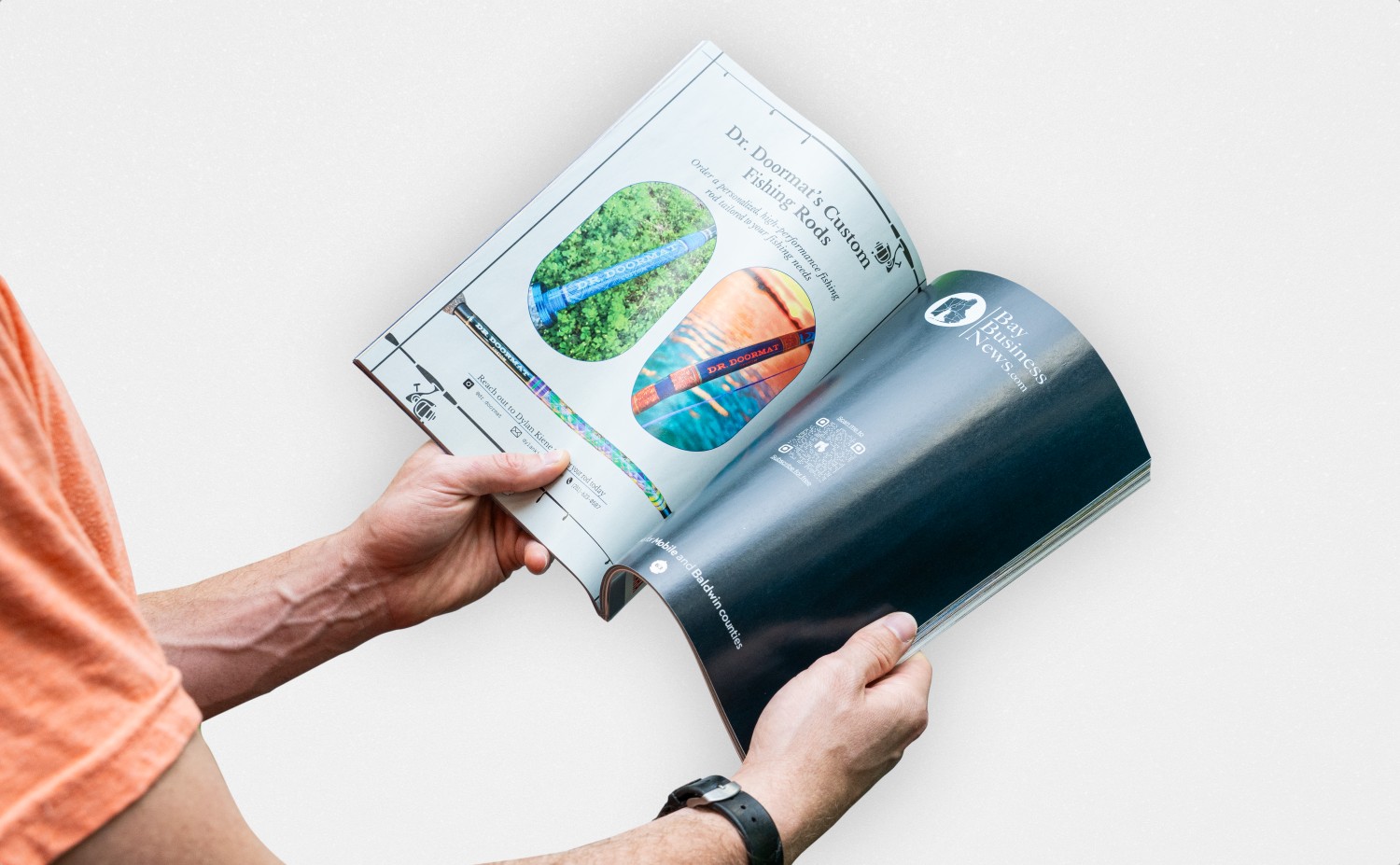Image of man holding magazine