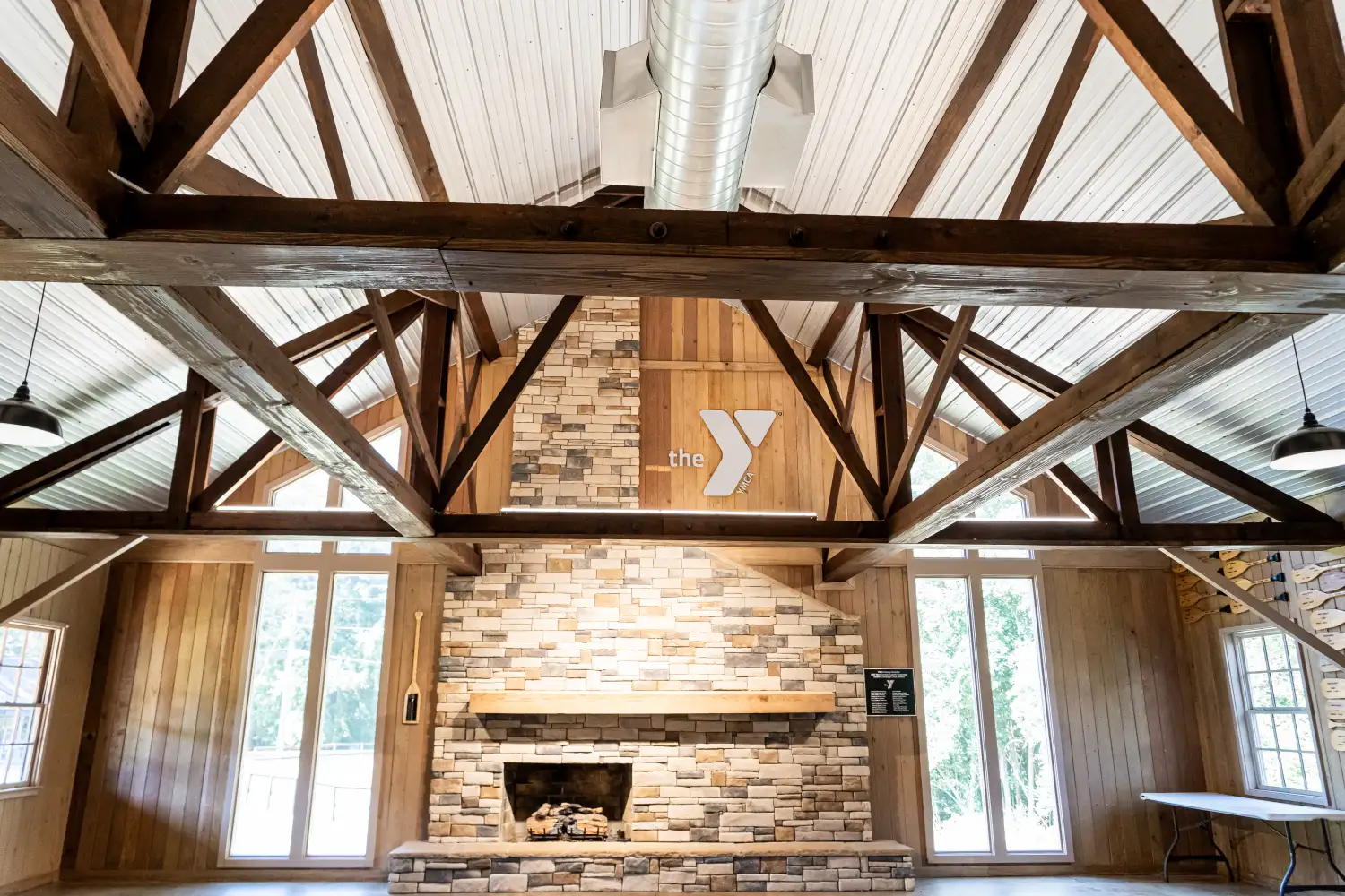 Brushed silver sign inside building with wooden structure