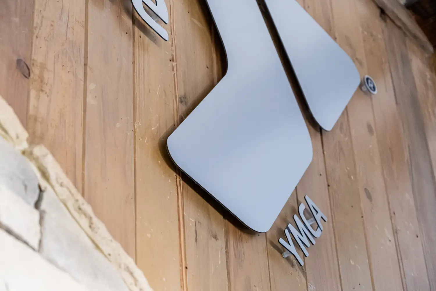 Brushed silver MaxMetal sign on wooden background