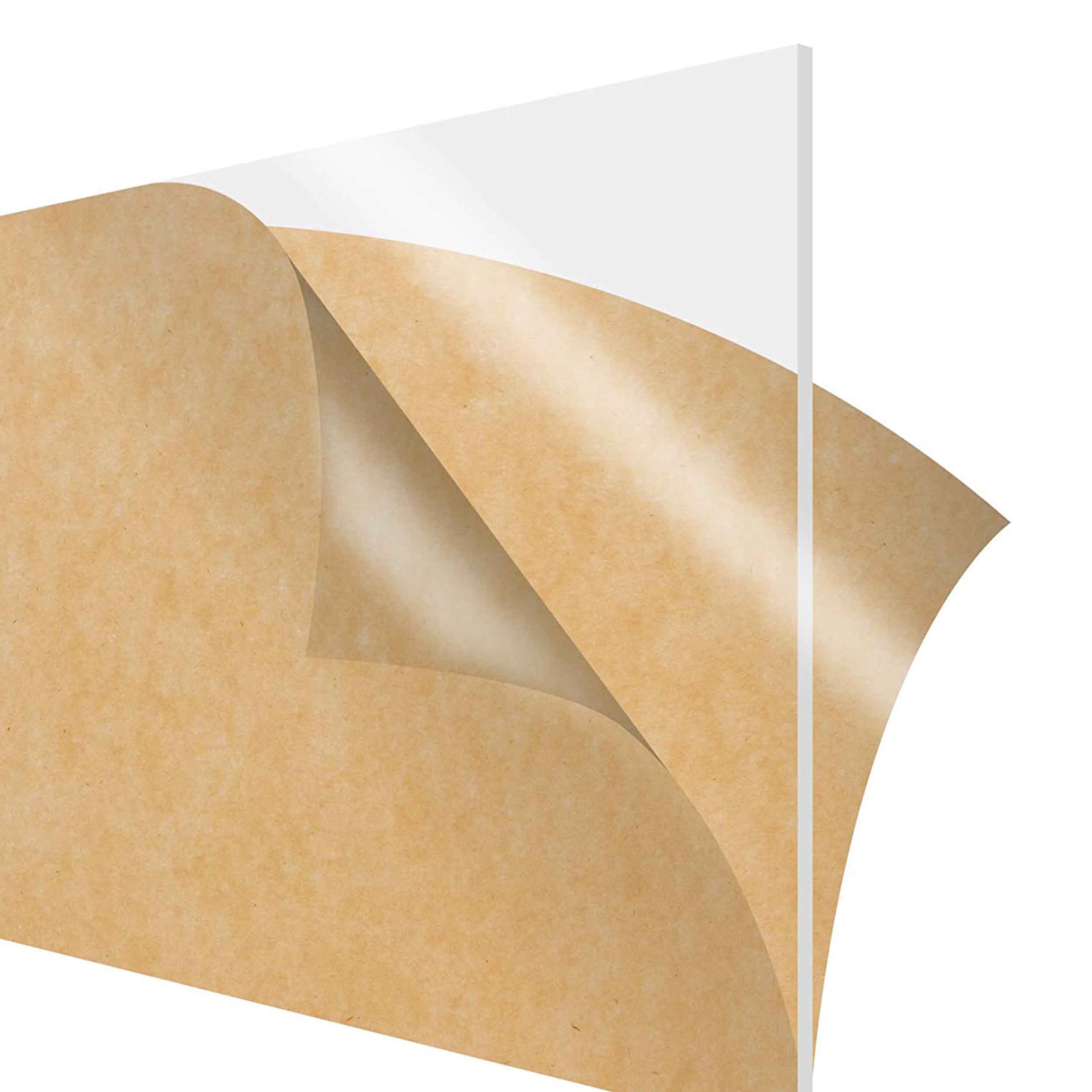 Acrylic sheet with brown paper protection layers being pulled off.