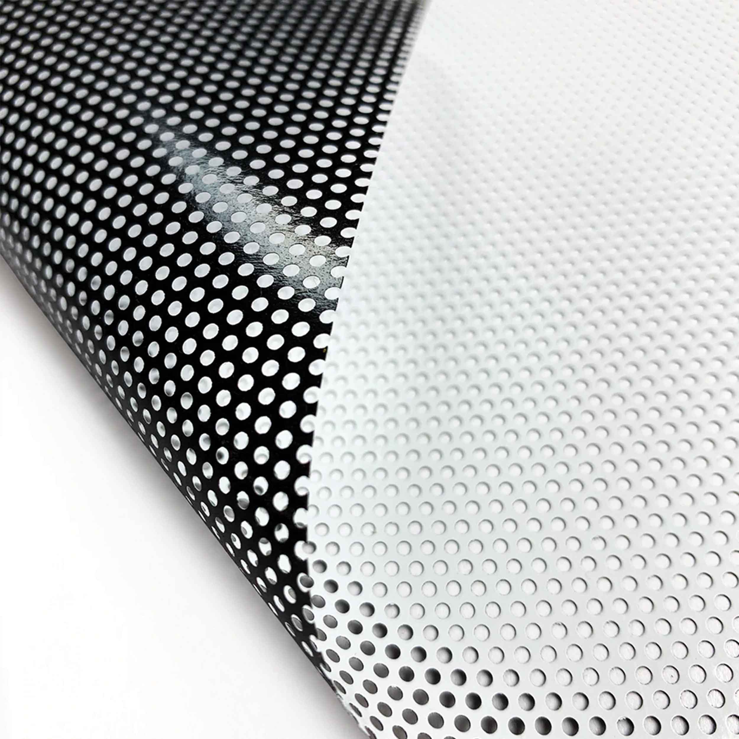 Material example of window perf showing white print side and black adhesive side.